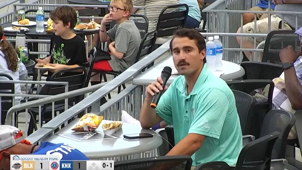 Knoxville Reporter's Hot Dog Review Interrupted by Home Run